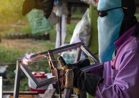 Welding of steel and fabric covering the face. photo