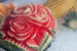 Carving roses on watermelon. photo