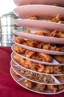 Shrimp and crispy fried beans in a tray. photo