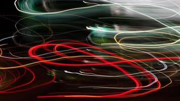 Light trails from panning on the streets at night. photo