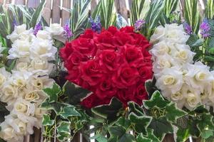 Red and white artificial roses. photo