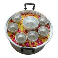 Bowl stainless steel pots floating flower petals. photo