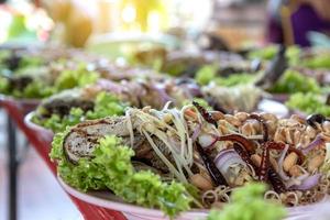 Fried snakehead fish with spicy and sour taste. photo