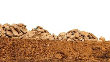 Isolated view of concrete debris piles on the ground. photo