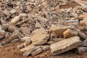 Concrete road debris is left on the ground. photo