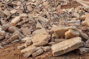 Concrete road debris is left on the ground. photo