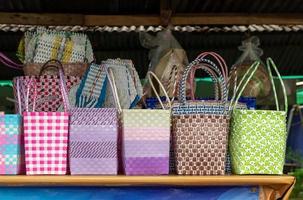 Many colorful plastic baskets in shop sheds. photo