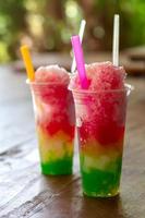Colorful smoothie ice in a clear glass. photo
