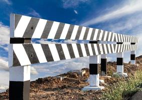 Wood blocks, black and white with sky clouds. photo