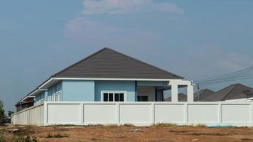 White concrete wall near the house.. photo