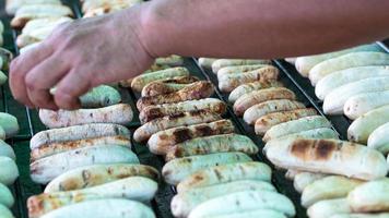 Hand and grilled bananas on the grill. photo