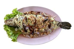 Crispy fish with salad on the plate. photo