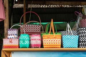 Many colorful plastic baskets in shop sheds. photo