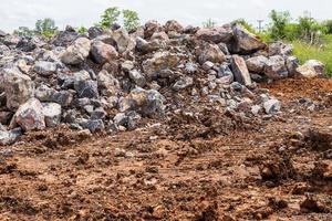 Numerous granite boulders lie on the ground in rural areas. photo