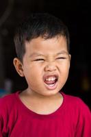 Thai boy open mouth. photo