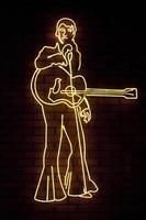 Neon light shaped into Elvis Presley photo