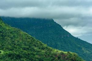 mountains with clouds in a tropical forest photo