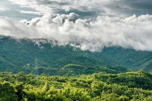 mountains with clouds in a tropical forest photo