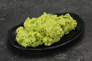 Avocado guacamole sauce with chili pepper photo