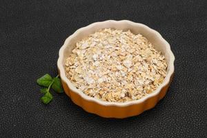 Raw oats in the bowl photo