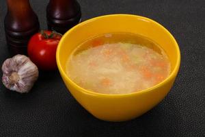 Chicken soup with noodles photo
