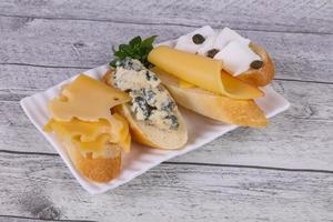 Bruschetta with various cheeses photo