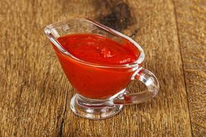 Homemade tomato sauce with spices photo