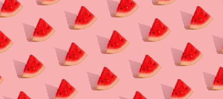 Pattern with watermelon slices isolated on pink.Abstract summer background. Banner format