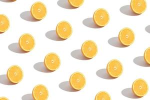 Sliced orange pattern isolated on white. Abstract summer background photo