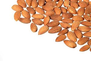 Tasty almonds nuts isolated on white background photo