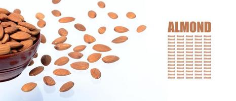 Almonds in a clay pot isolated on a white background photo