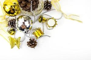 Christmas golden and silver decorations on white background basketweave. top view photo