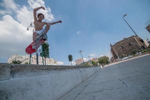 Milan, Italy, 2013-Boy with skateboard at train station photo