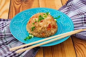 Tyahan with chicken and vegetables on wooden background photo