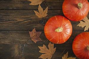 Mini pumpkins on wooden background. Thanksgiving day concept. photo