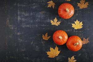 Mini pumpkins on wooden background. Thanksgiving day concept. photo