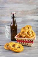 Homemade baked salt pretzel on wooden background. Oktoberfest concept photo