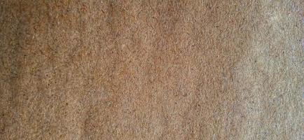 Brown wood fibers textured paper. Synthetic wood background design. Available for text. Suitable for poster, backdrop, presentation, wallpaper, commercial advertising of company and industry. photo