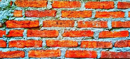 Red orange clay brick wall patterns. Classic architecture background design. photo