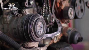 Car Engine Swinging On Lift Chain In Repair Shop video