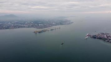 Aerial view panning right of ship vessel move at Penang sea. video