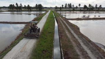 Follow tractors move at rural path video