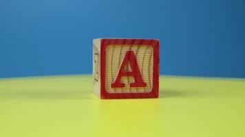 Close up shot letter A alphabet wooden block video