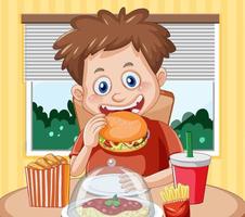 A boy eating junk food at the table