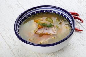 Chicken soup in bowl photo