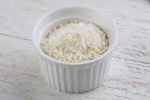 Coconut flakes in dish photo