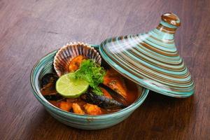 Bouillabaisse soup with fish and scallops photo