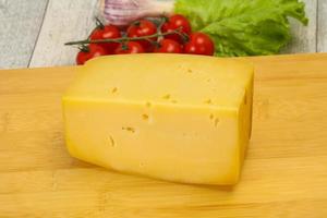 Hard yellow tasty cheese brick photo