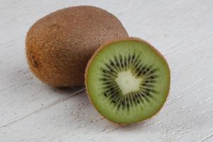 Kiwi fruit on wood photo