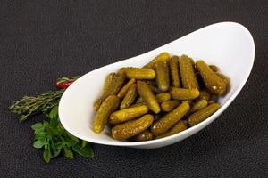 Pickled small cucumbers photo